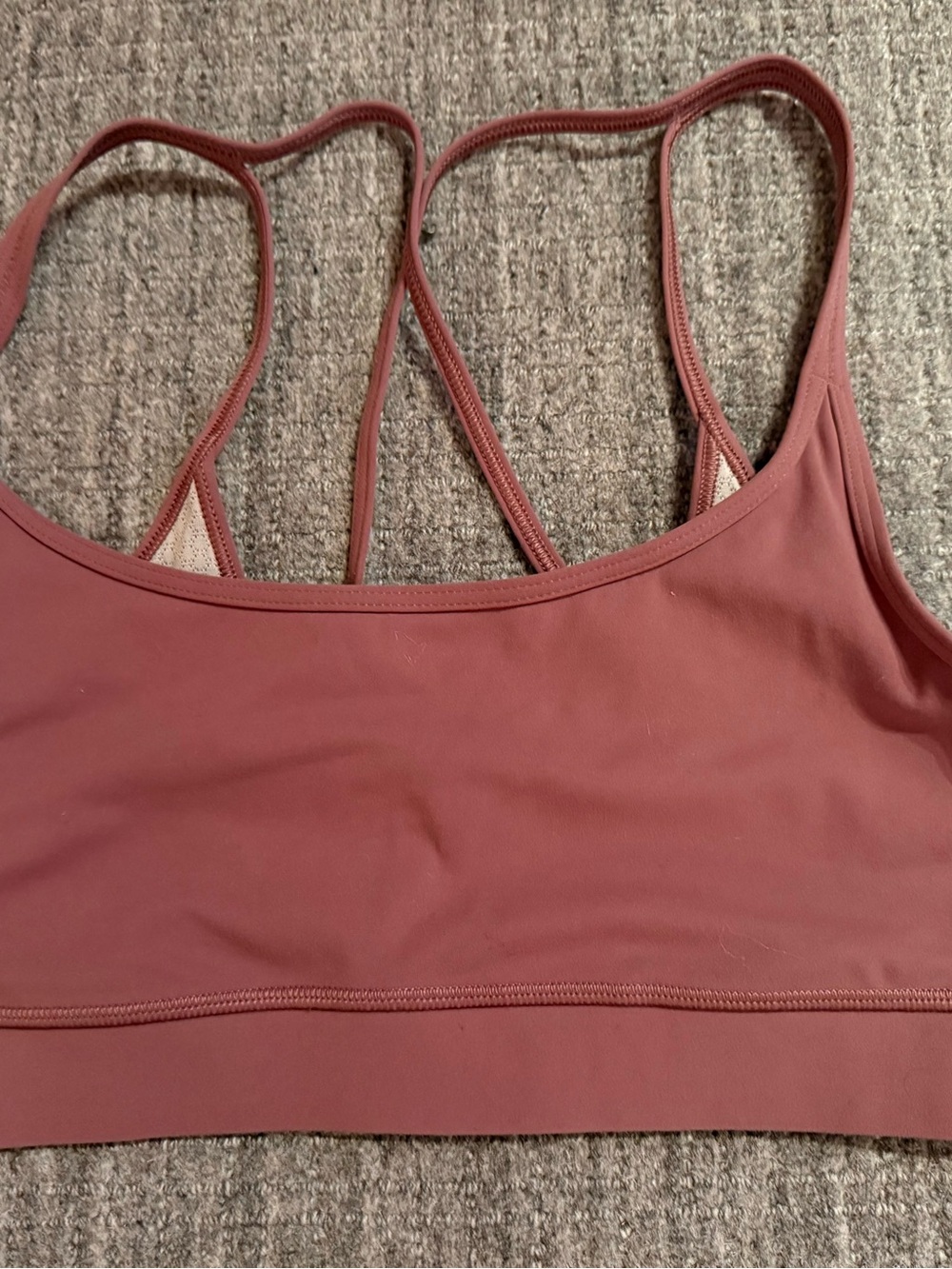 Vuori Strappy Sports Bra in terracota.